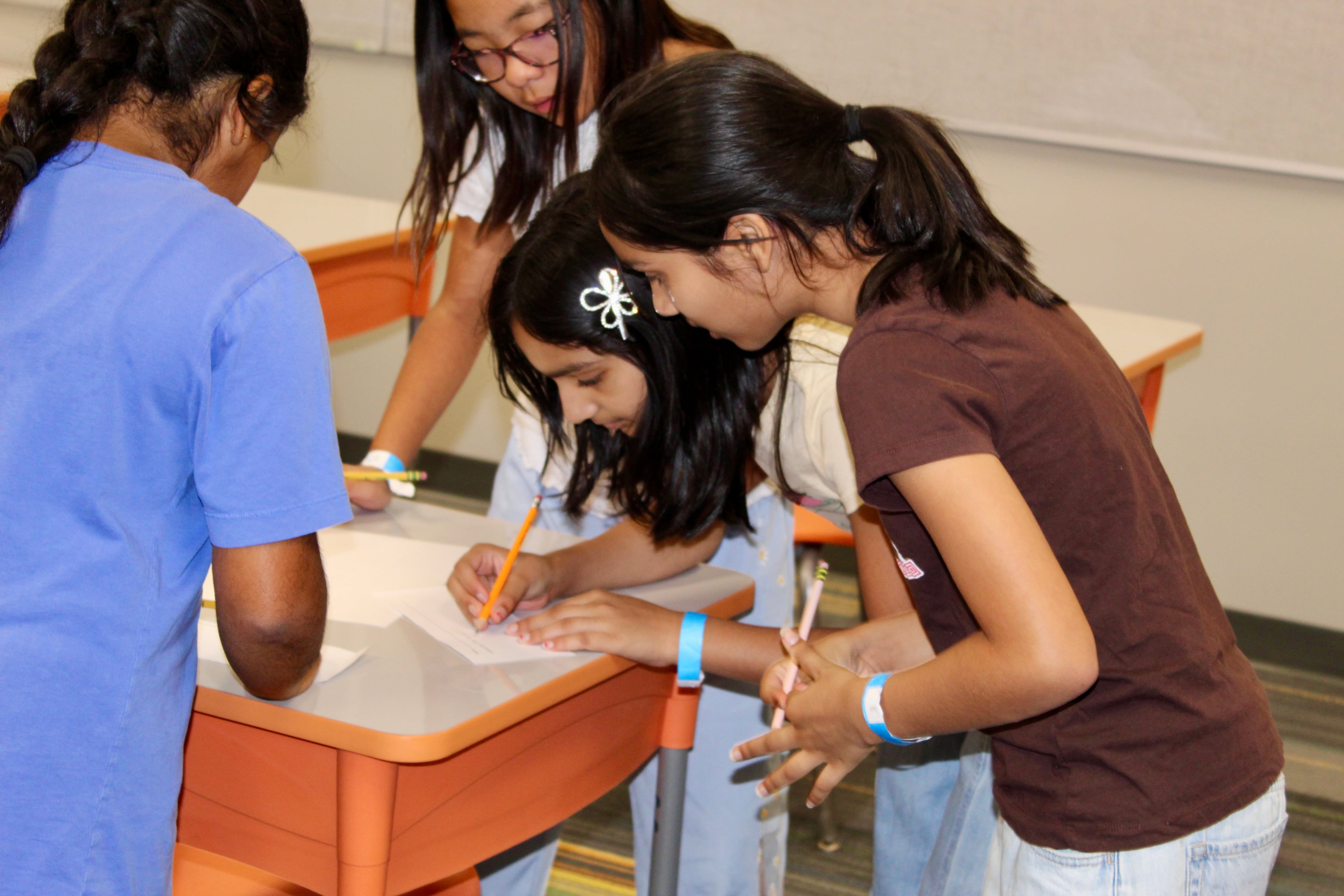 A team building a bridge during the Bridge Building event
